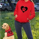 girl and dog wearing red hoodies