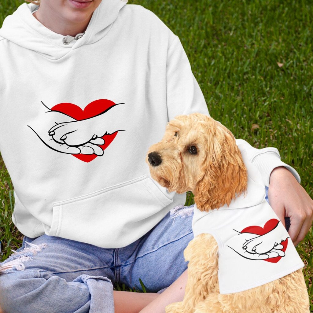 girl and dog wearing white hoodies