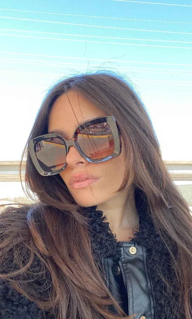 woman wearing large sunglasses