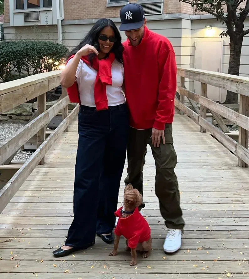 man, woman, dog in matching shirts