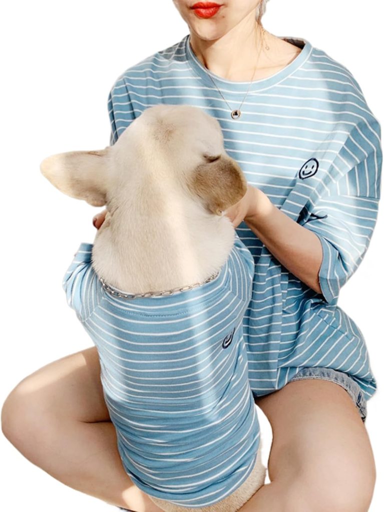 dog and owner wearing matching blue shirts