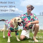 dog and man wearing matching hawaiian shirts