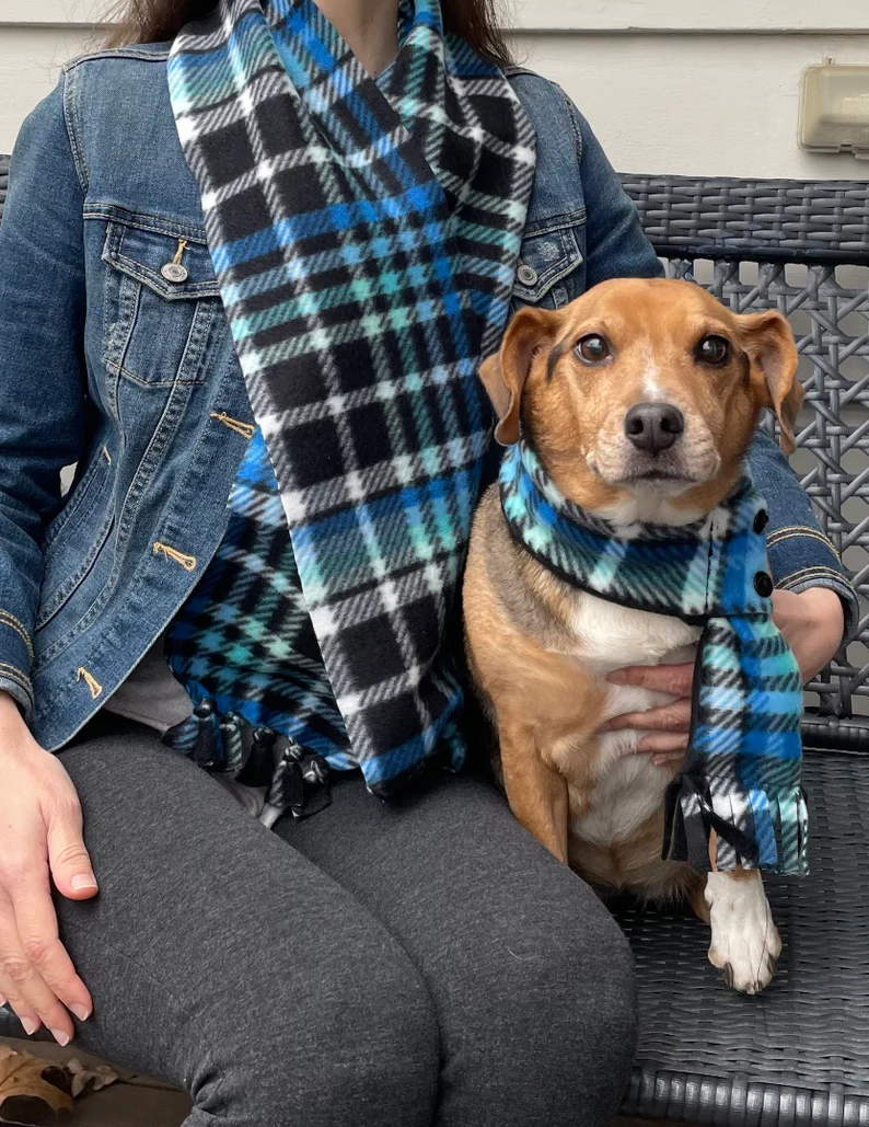 dog and owner wearing matching scarves