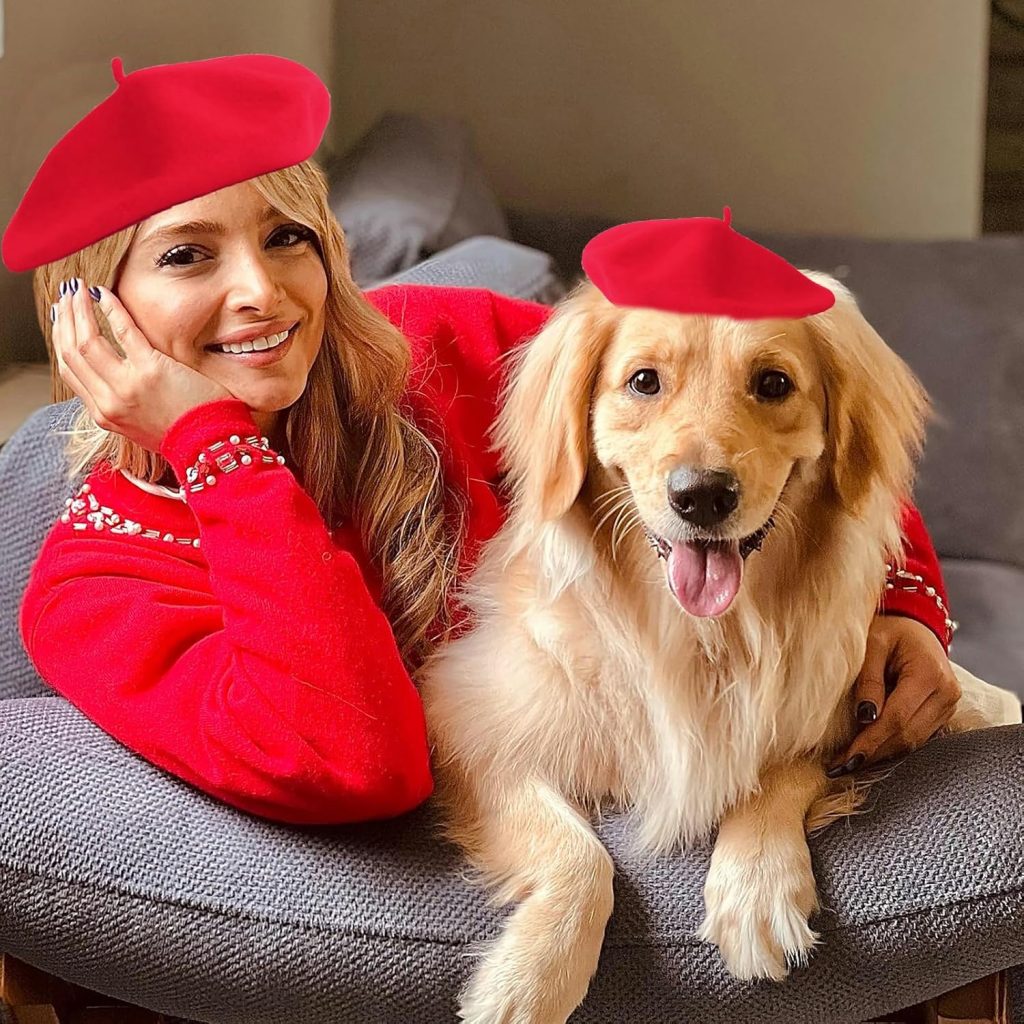 dog and owner wearing red berets