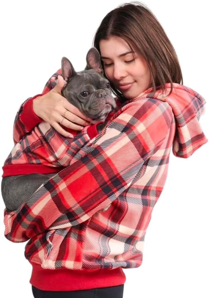 dog and owner wearing red plaid hoodies