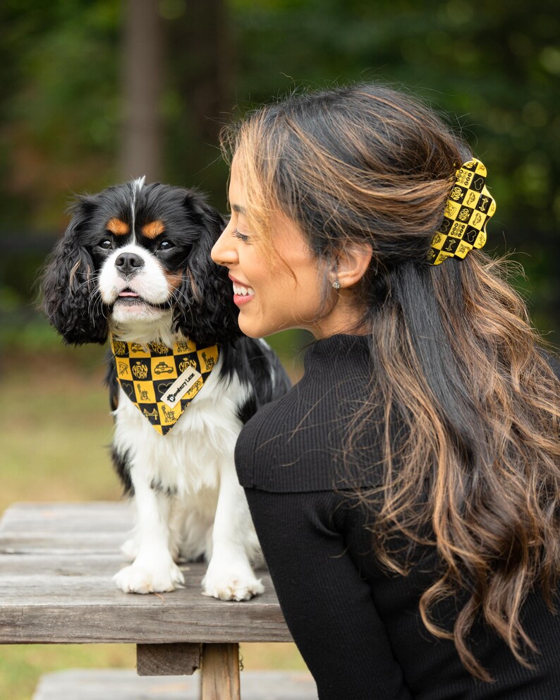 dog and owner wearing matching bandana and hair clip